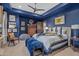 Another bedroom with a navy blue color scheme and plenty of light at 42383 N 111Th Pl, Scottsdale, AZ 85262