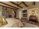Elegant Primary bedroom featuring a fireplace, large bed, and ample closet space at 42383 N 111Th Pl, Scottsdale, AZ 85262
