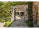 Inviting courtyard entry with stonework, fountain, and lush landscaping at 42383 N 111Th Pl, Scottsdale, AZ 85262