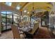 Formal dining room with arched windows and a large dining table at 42383 N 111Th Pl, Scottsdale, AZ 85262