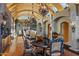 Grand dining room boasts high ceilings, a mural, and a large dining table at 42383 N 111Th Pl, Scottsdale, AZ 85262