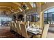 Elegant dining room with a long table and access to other areas at 42383 N 111Th Pl, Scottsdale, AZ 85262