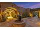Elegant entryway with arched doorway and a tranquil fountain at 42383 N 111Th Pl, Scottsdale, AZ 85262