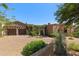 Stunning exterior of a luxurious home with a large driveway at 42383 N 111Th Pl, Scottsdale, AZ 85262