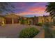 Stunning Spanish-style home with stone accents and a three-car garage at 42383 N 111Th Pl, Scottsdale, AZ 85262