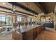 Rustic kitchen with large wood island and outdoor access at 42383 N 111Th Pl, Scottsdale, AZ 85262