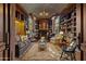 Cozy library with built-in bookshelves, fireplace and comfortable seating at 42383 N 111Th Pl, Scottsdale, AZ 85262