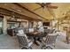 Outdoor dining area with round table and comfortable seating at 42383 N 111Th Pl, Scottsdale, AZ 85262