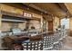 Outdoor kitchen with pizza oven, grill, and wood countertop at 42383 N 111Th Pl, Scottsdale, AZ 85262
