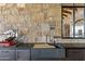 Outdoor kitchen with custom sink and stone countertop at 42383 N 111Th Pl, Scottsdale, AZ 85262