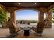 Covered patio with seating and mountain views at 42383 N 111Th Pl, Scottsdale, AZ 85262