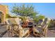 Outdoor patio with fire pit and comfortable seating at 42383 N 111Th Pl, Scottsdale, AZ 85262