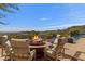 Outdoor patio features a fire pit and comfortable seating perfect for entertaining at 42383 N 111Th Pl, Scottsdale, AZ 85262