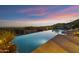 Luxury pool with mountain views at sunset at 42383 N 111Th Pl, Scottsdale, AZ 85262