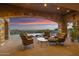 Covered patio area overlooking the pool and city views at 42383 N 111Th Pl, Scottsdale, AZ 85262
