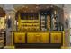 Fully stocked wet bar with a unique hand-painted design at 42383 N 111Th Pl, Scottsdale, AZ 85262