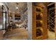 Impressive wine cellar with brick walls and ample storage for wine bottles at 42383 N 111Th Pl, Scottsdale, AZ 85262