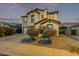 Two-story house with a two-car garage and desert landscaping at 25772 W Nancy Ln, Buckeye, AZ 85326