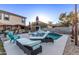 Relaxing poolside patio with lounge chairs and outdoor bar at 25772 W Nancy Ln, Buckeye, AZ 85326