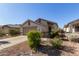 House exterior with garage, landscaping and driveway at 9744 N 97Th Ln, Peoria, AZ 85345