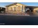 Single-wide manufactured home with landscaped yard at 11596 W Sierra Dawn Blvd # 382, Surprise, AZ 85378