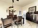 Bright dining room with a rustic wooden table and storage cabinet at 20 E Aero Rd, Mesa, AZ 85205