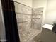 Large walk-in shower with tiled walls and grab bars at 20 E Aero Rd, Mesa, AZ 85205