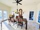 Elegant dining room with chandelier and access to a patio at 20 E Aero Rd, Mesa, AZ 85205