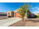 One-story home with a two-car garage and desert landscaping at 4512 W Suncup Dr, San Tan Valley, AZ 85144