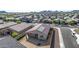 Aerial view of a house with solar panels and a spacious backyard in a residential area at 4512 W Suncup Dr, San Tan Valley, AZ 85144