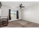 Bright bedroom with ceiling fan, neutral carpeting, and window coverings at 4512 W Suncup Dr, San Tan Valley, AZ 85144