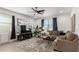 Spacious living room with a sectional sofa, coffee table, and large TV at 4512 W Suncup Dr, San Tan Valley, AZ 85144