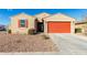 One-story home with a two-car garage and desert landscaping at 4512 W Suncup Dr, San Tan Valley, AZ 85144