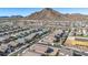 Residential neighborhood with mountain views and numerous houses at 4512 W Suncup Dr, San Tan Valley, AZ 85144