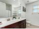 Bathroom with double vanity, shower, and ample storage at 4512 W Suncup Dr, San Tan Valley, AZ 85144