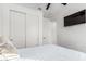 Spacious bedroom with large closet and mounted TV at 4512 W Suncup Dr, San Tan Valley, AZ 85144