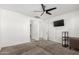 Bright bedroom with ceiling fan, neutral carpeting, and window coverings at 4512 W Suncup Dr, San Tan Valley, AZ 85144