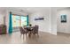 Small dining area with round table and four gray chairs at 4512 W Suncup Dr, San Tan Valley, AZ 85144