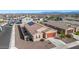 Aerial view of house with solar panels and two-car garage at 4512 W Suncup Dr, San Tan Valley, AZ 85144