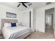 Bedroom with a view of the hallway, featuring a comfortable bed at 4512 W Suncup Dr, San Tan Valley, AZ 85144
