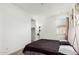 Spacious bedroom with a queen bed, neutral carpeting, and an ensuite bathroom at 4512 W Suncup Dr, San Tan Valley, AZ 85144