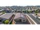 Aerial view of a house with solar panels and desert landscaping at 4512 W Suncup Dr, San Tan Valley, AZ 85144