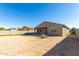Backyard of house with covered patio and empty space at 4512 W Suncup Dr, San Tan Valley, AZ 85144