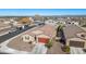 Aerial view of house with solar panels and two-car garage in a neighborhood at 4512 W Suncup Dr, San Tan Valley, AZ 85144