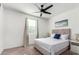 Well-lit bedroom featuring a striped bedspread and window coverings at 4512 W Suncup Dr, San Tan Valley, AZ 85144