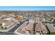 Aerial view of house with solar panels and two-car garage in a neighborhood at 4512 W Suncup Dr, San Tan Valley, AZ 85144