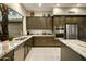 Gourmet kitchen with granite countertops and stainless steel appliances at 6329 E Evening Glow Dr, Scottsdale, AZ 85266