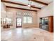 Bright and airy living room with hardwood floors and built-in entertainment center at 23724 S 126Th St, Chandler, AZ 85249