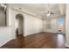Living room with hardwood floors, balcony access and bathroom view at 14575 W Mountain View Blvd # 11312, Surprise, AZ 85374