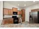 Modern kitchen with stainless steel appliances and ample cabinetry at 14575 W Mountain View Blvd # 11312, Surprise, AZ 85374